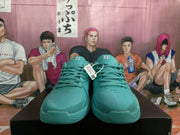 Front view of the lake blue Nike sneakers showing the lace closure, padded tongues, and rounded toe boxes.