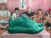 Side view of a mint green basketball sneaker with lace-up fastening, tonal overlays, and sculpted sole