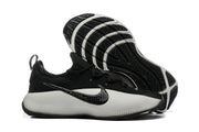 Training shoe side view with the outsole exposed, showing its tread pattern.