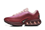 Side profile showing the pink gradient upper and visible cushioning elements.