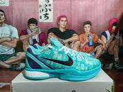 Side profile showing the sky blue basketball sneaker, black Swoosh, purple heel panel, and Nike Zoom midsole branding.