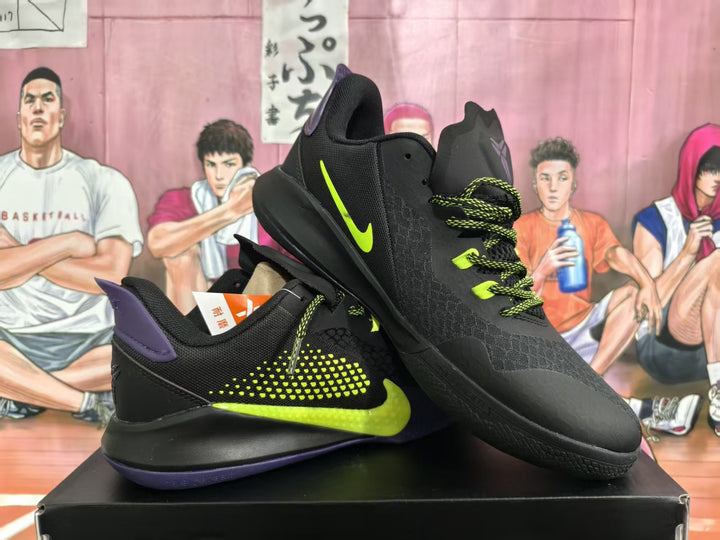 Pair of black Nike basketball sneakers with bright yellow-green swooshes, purple accents, and woven laces, shown at an angle.