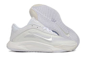 White-and-silver Nike A'ja Wilson 1 shoe with the patterned outsole visible.