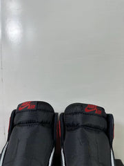 Close-up of the black padded tongues with red Nike Air branding.