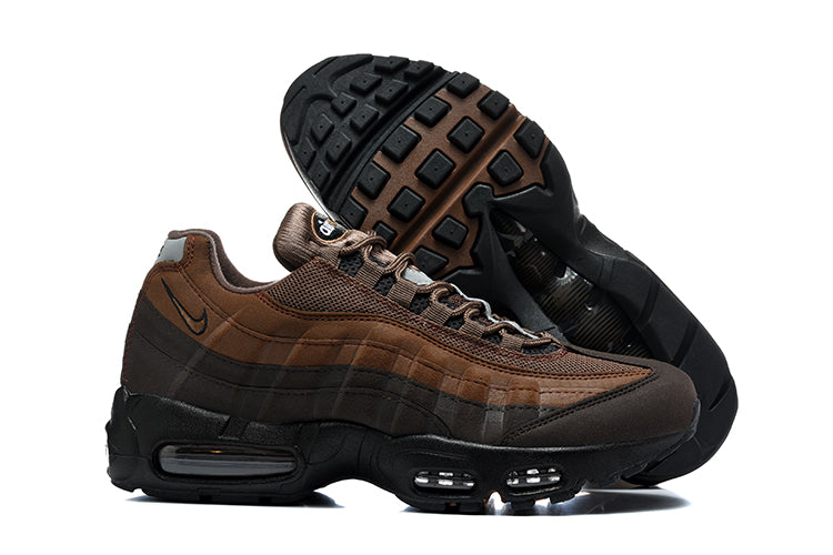 Side profile and outsole view of brown Nike Air Max 95 TT sneakers.