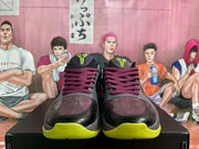 Front view showing the perforated toes, burgundy laces, lime green outsole, and small printed markings on the toe area.
