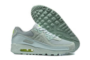Nike Air Max 90 QS sneakers shown beside the patterned outsole.