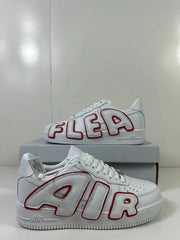 Close side view highlighting the oversized AIR lettering outlined in red on the white upper.