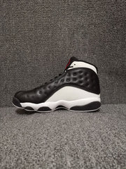 Side profile of a black and white Air Jordan 13 Retro high-top sneaker