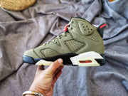 Side view of the sneaker highlighting the perforated upper panels, ankle detail, and translucent outsole.