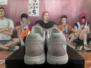 Rear view of the sneaker pair showing padded collars, translucent-looking heel sections, and heel graphics.