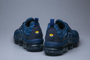 Rear view of the blue sneakers showing heel details and pod-style soles.