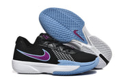 Side and outsole view of the sneakers, showing the purple-and-blue side logo, white midsole, and patterned light blue outsole.