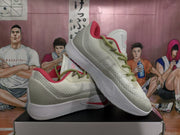 Pair of white and gray Nike basketball sneakers with lemon-green laces and pink accents displayed on a shoebox.