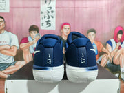 Rear view of navy basketball shoes with white outsoles