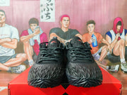 Front view of the pair showing black laces, padded collars, textured toe areas, and dark outsoles.