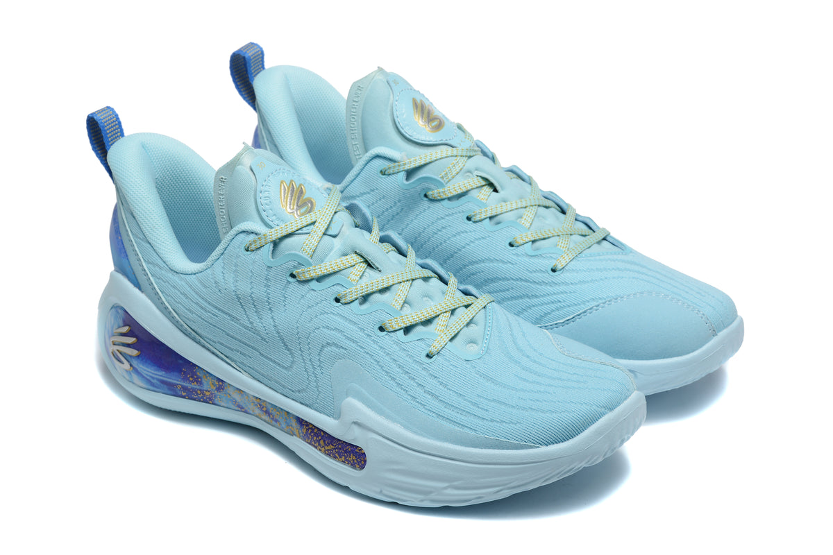Pair of blue Curry basketball sneakers shown from a three-quarter front angle, with purple-and-gold heel detailing.