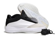 White and black Jordan 40 shoe pair with a patterned outsole visible.