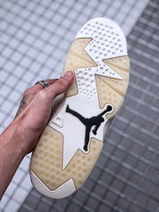 Bottom view showing the white and translucent outsole with a black Jordan logo.
