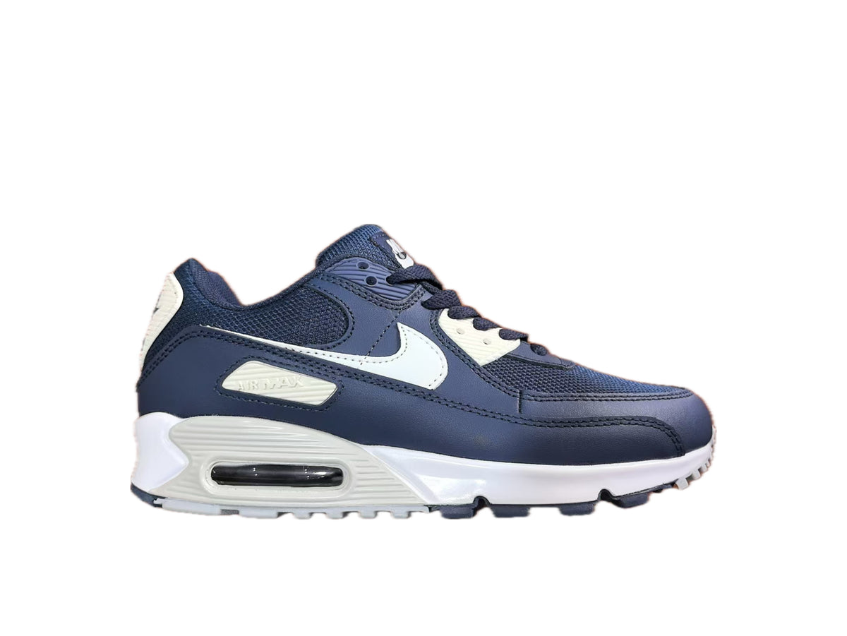 Side view of a navy and white Nike Air Max 90 sneaker