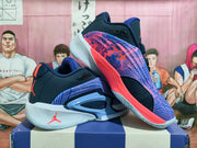 Angled view of the patterned purple upper and contrasting sole