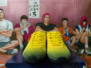 Front view of yellow Nike basketball shoes with black outsole detailing