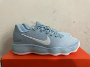 Side view of a light blue Nike basketball shoe with a white Swoosh and ridged sole.