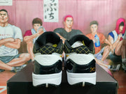 Rear view showing the heel design and black-and-gold collar pattern