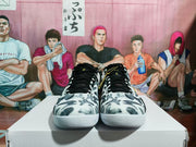 Front view of the pair showing black laces, patterned toe boxes and white rubber outsoles.