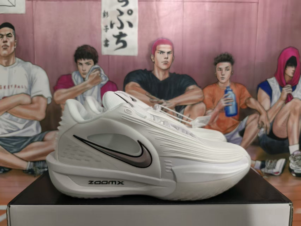 Side view of white Nike basketball sneakers with black Swoosh details and visible ZoomX marking.