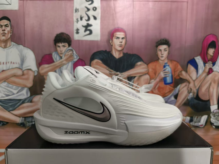 Side view of white Nike basketball sneakers with black Swoosh details and visible ZoomX marking.