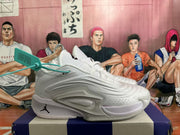 Side profile of a white and grey Jordan basketball sneaker showing the layered upper and sculpted midsole.