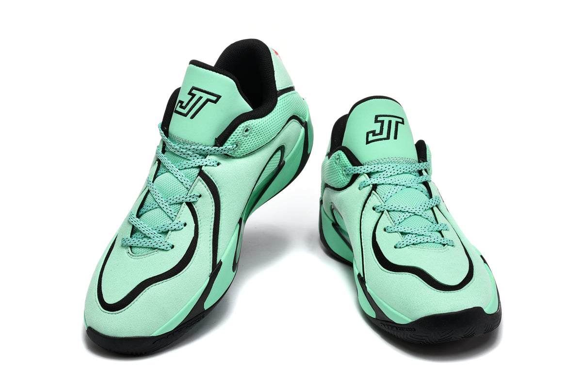 Pair of green and black Jordan sneakers shown from the front, with lace-up closures, black trim, and Jumpman tongue logos.