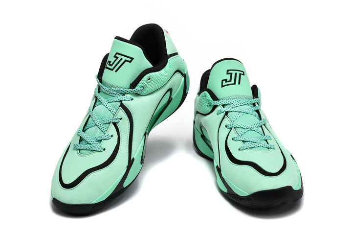 Pair of green and black Jordan sneakers shown from the front, with lace-up closures, black trim, and Jumpman tongue logos.