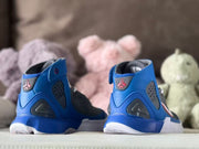 Rear view showing blue heel sections, dark translucent panels, and Kobe-related heel logos.