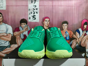 Front view of green Nike basketball shoes with laces and lime-colored soles.