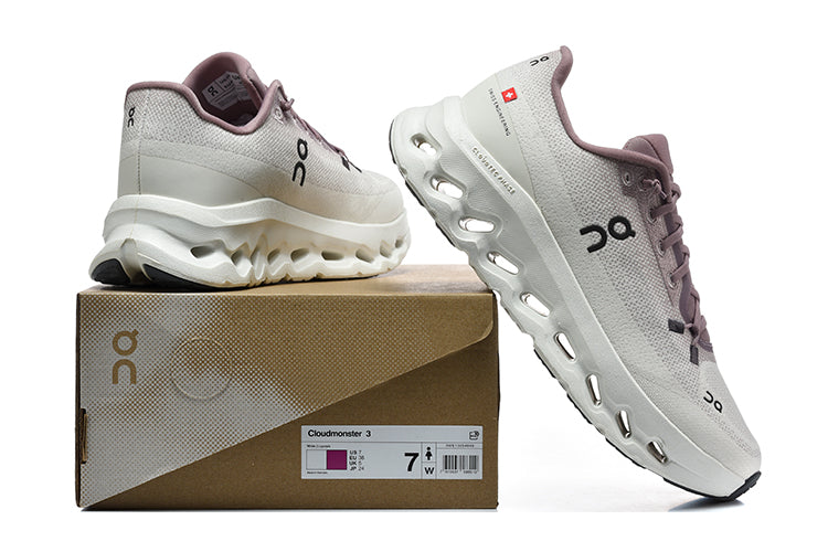 White and mauve On Cloudmonster 3 shoes shown with their box; the box label shows size 7.