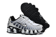 Silver Nike Shox TL sneaker beside a view of its black outsole.