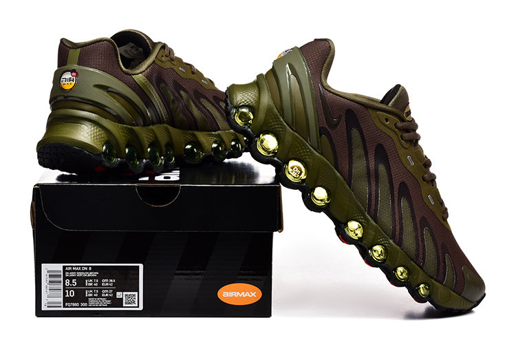 Nike Air Max DN sneakers in olive and brown displayed on a shoe box; the label shows a photographed sample size.
