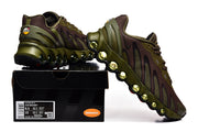 Nike Air Max DN sneakers in olive and brown displayed on a shoe box; the label shows a photographed sample size.