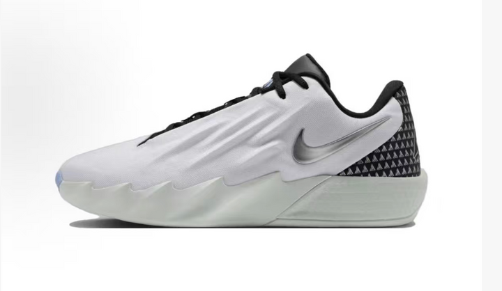 Side view of a white and black Nike low-top sneaker with a metallic-look Swoosh and patterned heel panel.