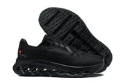 Black On running shoe shown from the side with its sculpted outsole visible.