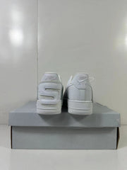 Rear view of the white sneaker pair showing branded heel panels and raised lettering.