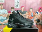 Side profile of a black and gray high-top basketball sneaker showing the Under Armour logo, SC marking, lace-up closure, and layered sole.