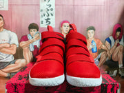 Front view of red Nike high-top basketball shoes with multiple straps