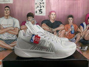 Pair of white Nike basketball sneakers shown in side view with gray Swoosh detailing and basketball-themed hangtags.