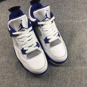 Front view of the pair showing white laces, blue tongue branding, and blue outsole edges.