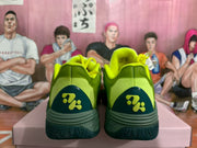 Rear view showing the padded collars, dark green heel panels, and contrasting heel emblems.