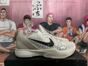 Side view showing the off-white upper, black Nike branding, raised star details, and sculpted sole.