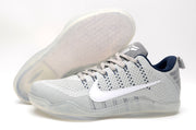 Gray Nike Kobe 11 shoe beside a view of its translucent-looking outsole
